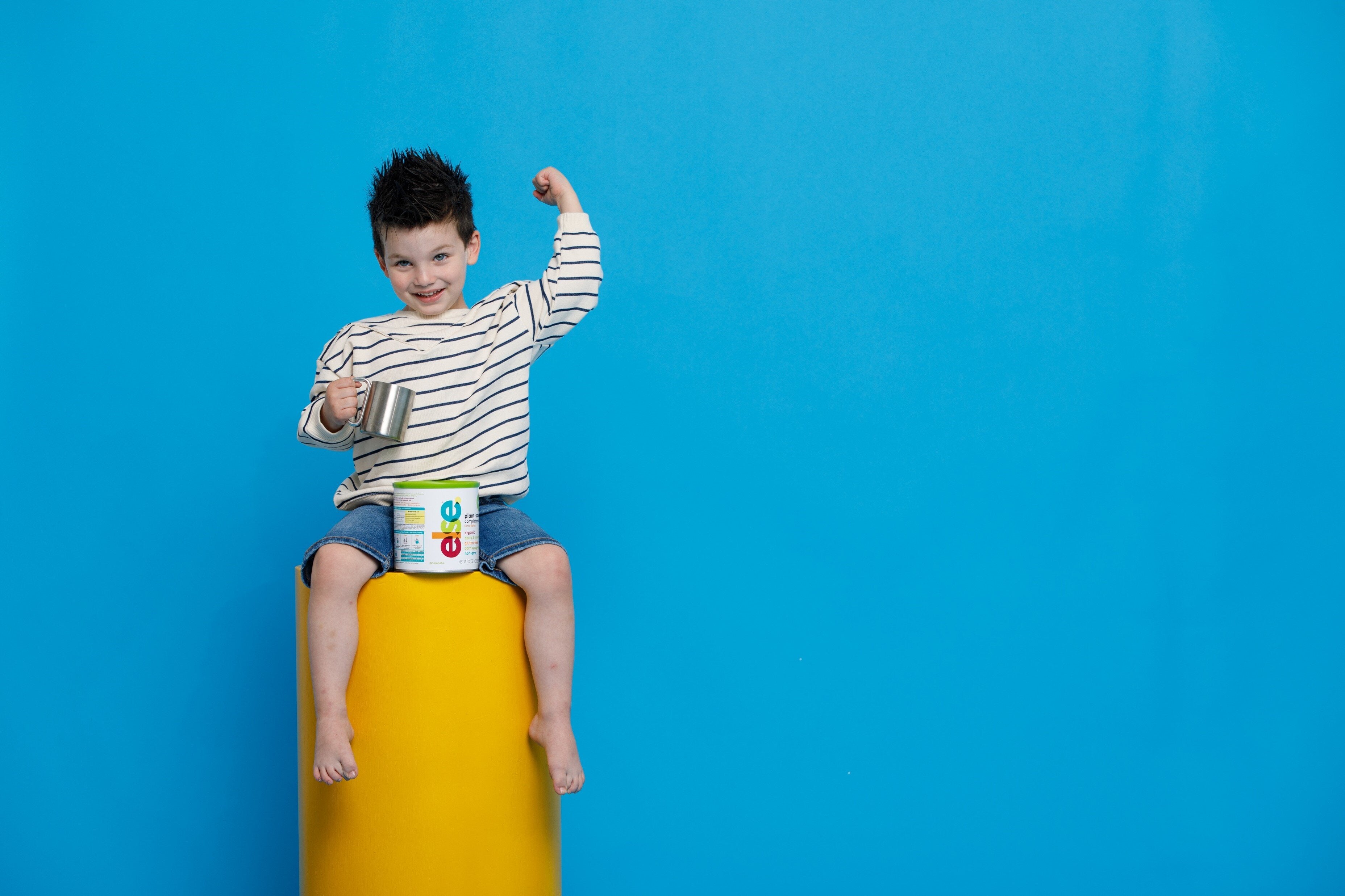 else nutrition toddler with fist in air
